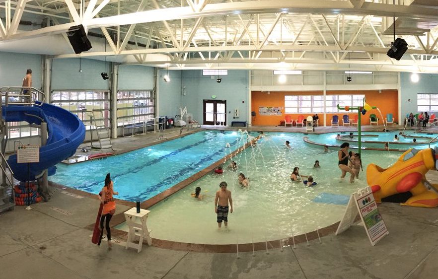 TRUCKEE PARKS AND REC POOL WITH PEOPLE SWIMMING